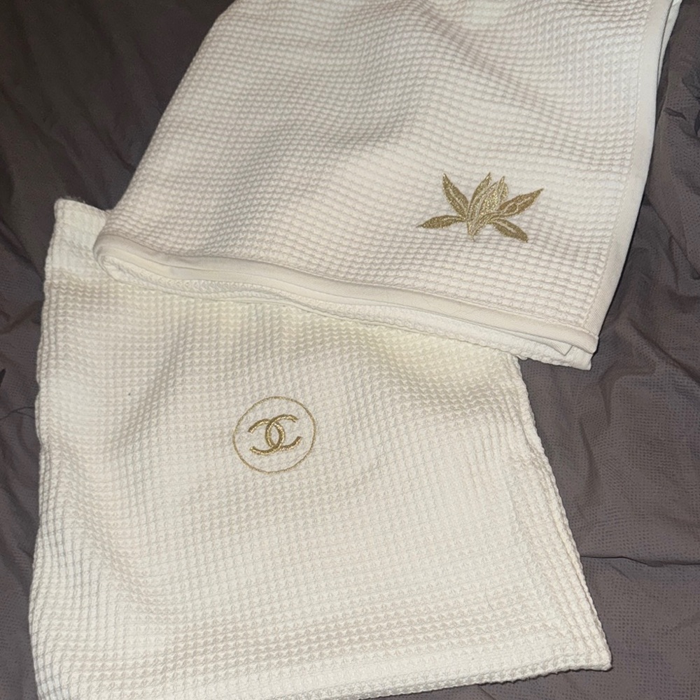 CHANEL Sublimage Cream Waffle Knit Towel with Gold Accents and drawstring bag